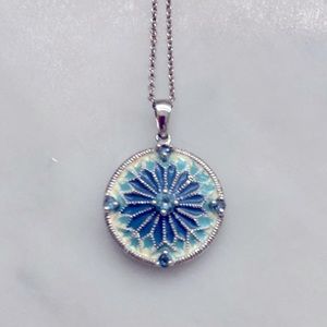 Tiffany & Co sterling silver chain & silver dollar blue topaz sterling pendant.